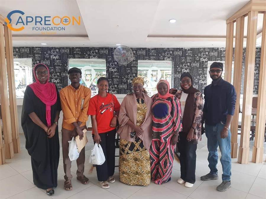 Caprecon team members and partners gathered indoors